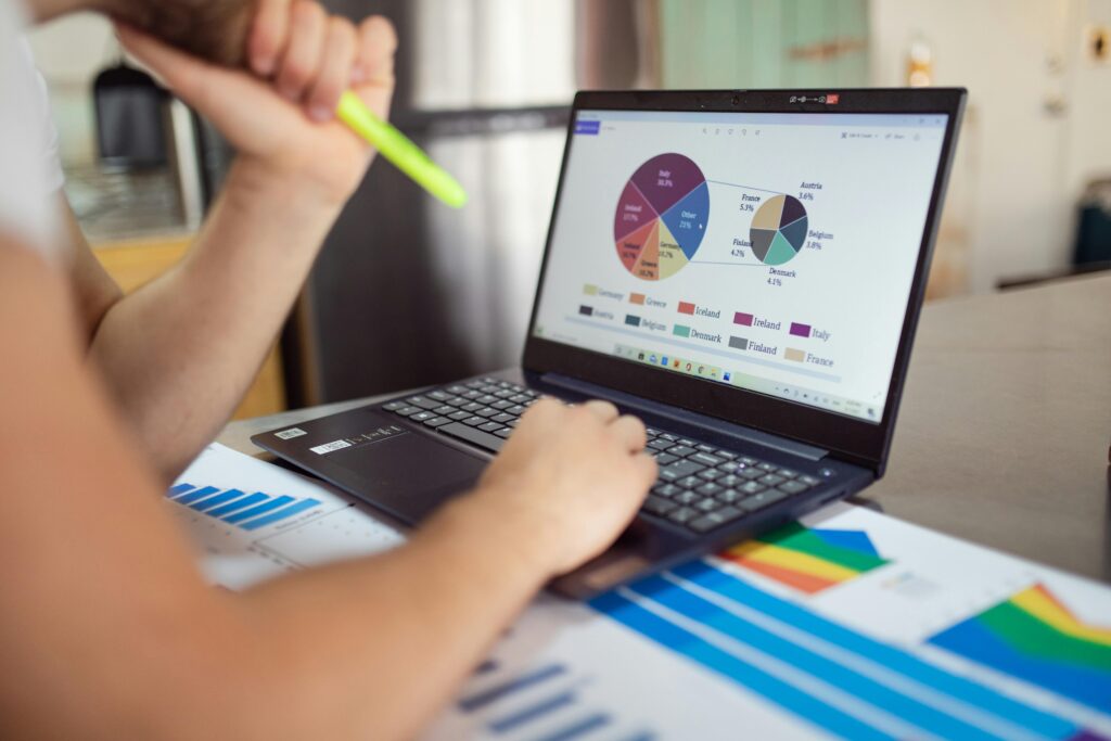 Man looking at KPIs on laptop