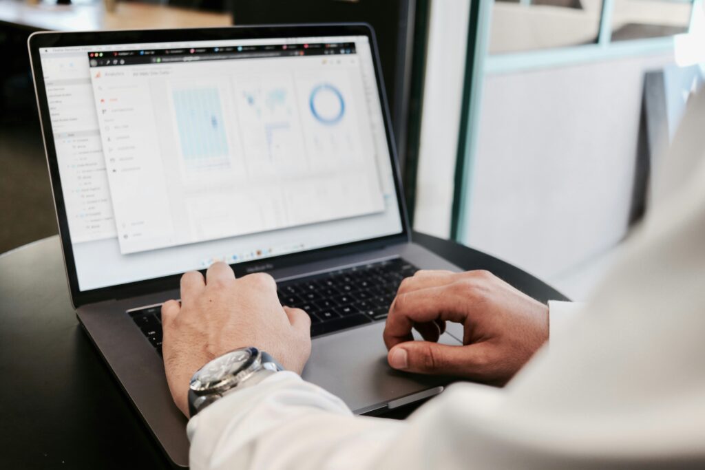 Measure Success with KPIs Person analyzing data on laptop