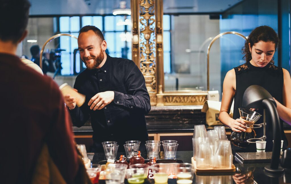 Work Together to Build the Culture You Want Barista preparing drinks at counter.