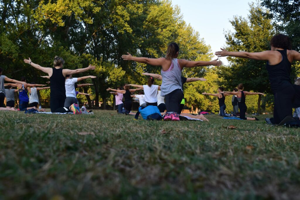 Group yoga session in park