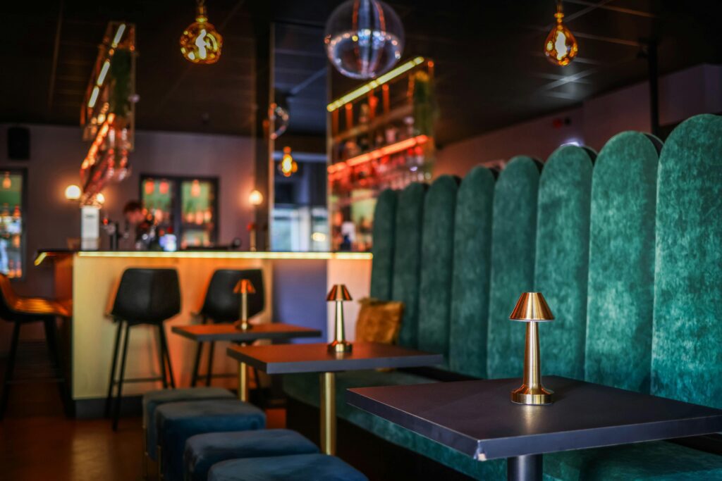 Stylish bar inside a private social club with green seating area