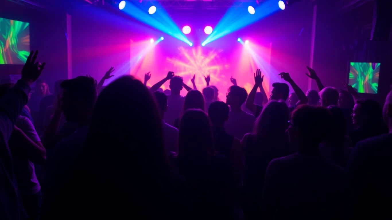 People enjoying themselves at a lively club with colorful lights.